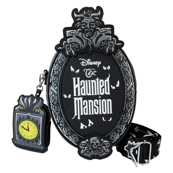 Welcome, foolish and fashionable mortals! This crossbody bag has all the thrills worthy of a theme park attraction. Inspired by the Haunted Mansion’s iconic title plaque, this bag pays homage to the home of happy haunts. You’ll even find a detachable coin bag shaped like a grandfather clock! With glow-in-the-dark features to highlight this chilling design, this accessory is the perfect pairing for any Disney parks fan. Features: Vegan leather (polyurethane) Adjustable (detachable) shoulder strap Zippered closure Shiny silver hardware Detachable coin bag Applique, debossed, glow-in-the-dark, and printed details Coordinating inside lining Dimensions: 7.2”W x 9.5”H x 3”D This bag is an officially licensed Disney product.