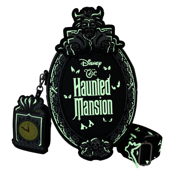 Welcome, foolish and fashionable mortals! This crossbody bag has all the thrills worthy of a theme park attraction. Inspired by the Haunted Mansion’s iconic title plaque, this bag pays homage to the home of happy haunts. You’ll even find a detachable coin bag shaped like a grandfather clock! With glow-in-the-dark features to highlight this chilling design, this accessory is the perfect pairing for any Disney parks fan. Features: Vegan leather (polyurethane) Adjustable (detachable) shoulder strap Zippered closure Shiny silver hardware Detachable coin bag Applique, debossed, glow-in-the-dark, and printed details Coordinating inside lining Dimensions: 7.2”W x 9.5”H x 3”D This bag is an officially licensed Disney product.