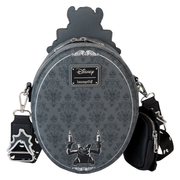 Welcome, foolish and fashionable mortals! This crossbody bag has all the thrills worthy of a theme park attraction. Inspired by the Haunted Mansion’s iconic title plaque, this bag pays homage to the home of happy haunts. You’ll even find a detachable coin bag shaped like a grandfather clock! With glow-in-the-dark features to highlight this chilling design, this accessory is the perfect pairing for any Disney parks fan. Features: Vegan leather (polyurethane) Adjustable (detachable) shoulder strap Zippered closure Shiny silver hardware Detachable coin bag Applique, debossed, glow-in-the-dark, and printed details Coordinating inside lining Dimensions: 7.2”W x 9.5”H x 3”D This bag is an officially licensed Disney product.