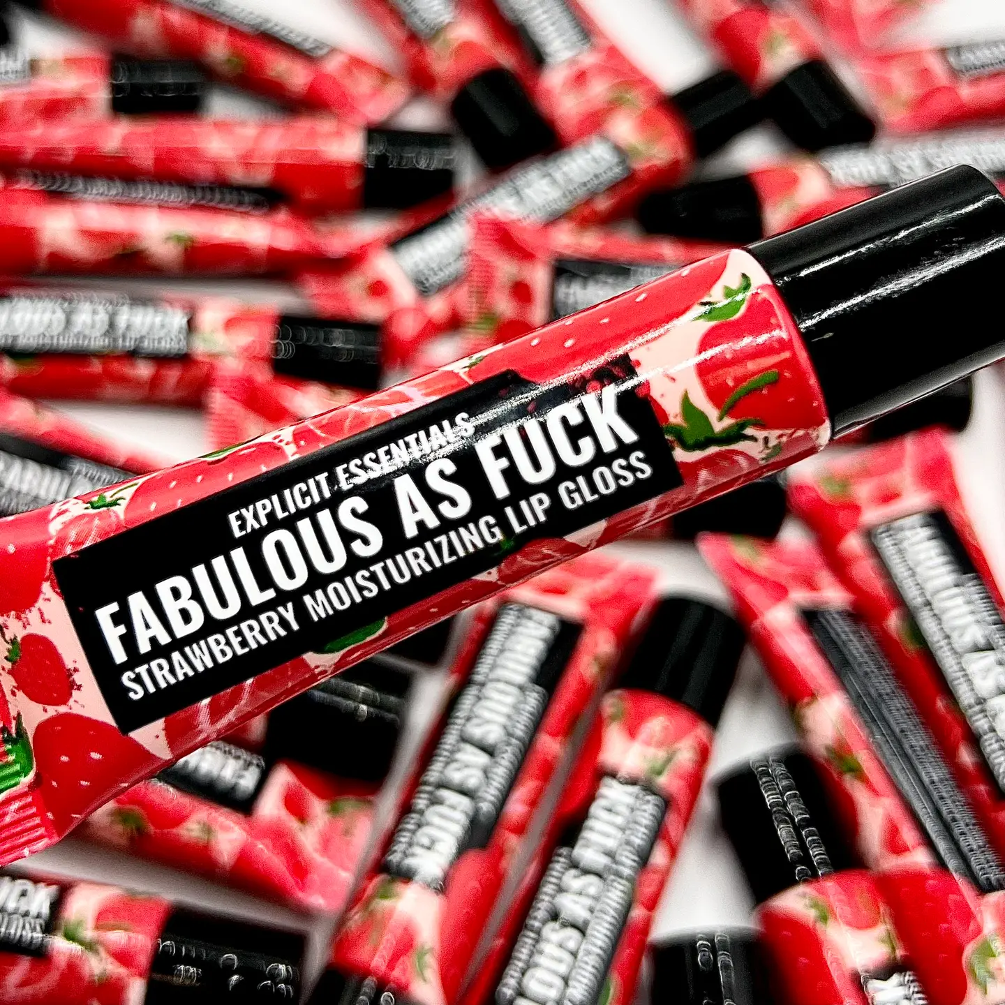 Add a touch of sweetness to your beauty routine with our Fabulous as Fuck Strawberry Lip Gloss! This luscious gloss delivers a sheer, juicy color that enhances your natural lip tone while providing a glossy, high-shine finish. Infused with the delightful scent of fresh strawberries, it's like a burst of summer with every application. Keep your lips feeling soft and smooth with our versagel based lip gloss.  • Handmade in the USA • Women Owned and Operated Business • Cruelty Free • Small Batch Ingredients Include: Versagel, Mica Powder, Candy Oil All content and images copyright © 2010-2024 by Explicit Essentials