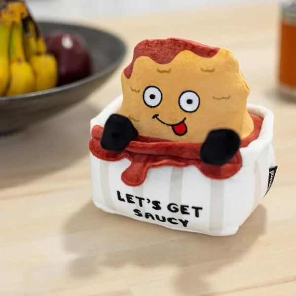 PUNCHKINS - "Let’s Get Saucy” Chicken Nugget Plushie CANNONBALL! This nugget is all about making a splash! He’s the perfect plushie to gift and show everyone it’s time to sauce up the place and have some fun.