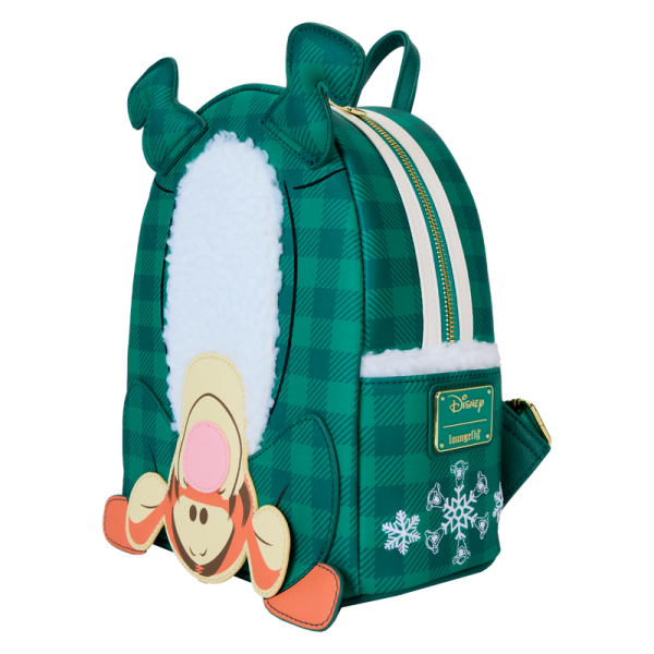 Joyful and plaid! Disney’s Tigger has flipped upside down to help you send warm holiday wishes. Our festive backpack features Tigger in green plaid pajamas. An applique of Tigger’s head appears at the bottom, and his padded applique feet stick up on top. Fuzzy white sherpa material down the middle adds a soft touch. Flip the backpack around, and you’ll find an applique print of a button flap and Tigger’s tail. Pack just what you need for the day to bounce into the holidays and spread good cheer wherever you go. Features: Vegan leather (polyurethane) Padded, adjustable shoulder straps Side panels with sherpa material and embroidered snowflakes Zippered main compartment Gold-colored metal hardware Applique, embroidered, sherpa, and printed details Coordinating inside lining Dimensions: 9”W x 10.5”H x 4.5”D This backpack is an officially licensed Disney product.