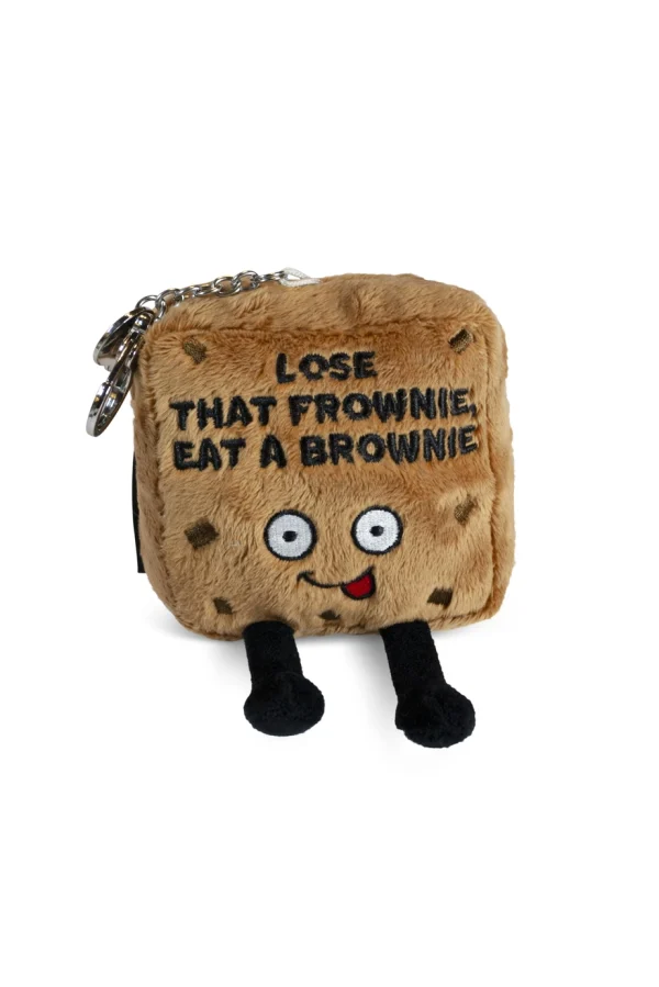 Don't be sad; this little guy thinks you're the fudging best! He knows things will get better soon, and if they don't, at least you always have brownies! His silly expression, dangly legs, and 3D chocolate chips earn him some brownie points on the cuteness scale. Head bake the perfect addition to any backpack or bag. He's the perfect gift for any brownie lover with a sweet sense of humor. This plush is ideal for children, collectors, or anyone who loves cozy and fun decor.