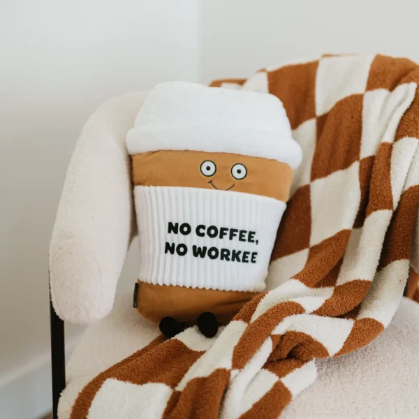 This oversized plushie is the perfect accessory to help you espresso self: no coffee, no workee. This pillow-sized plush is a mug-nificent sign to everyone that you can't brew it until you have your morning cup of Joe. His caffeinated expression, puffy lid, and 3D coffee sleeve make him a must-have. He'd make a brew-tiful addition to any office or home. This plush is ideal for children, collectors, or anyone who loves cozy and fun decor.