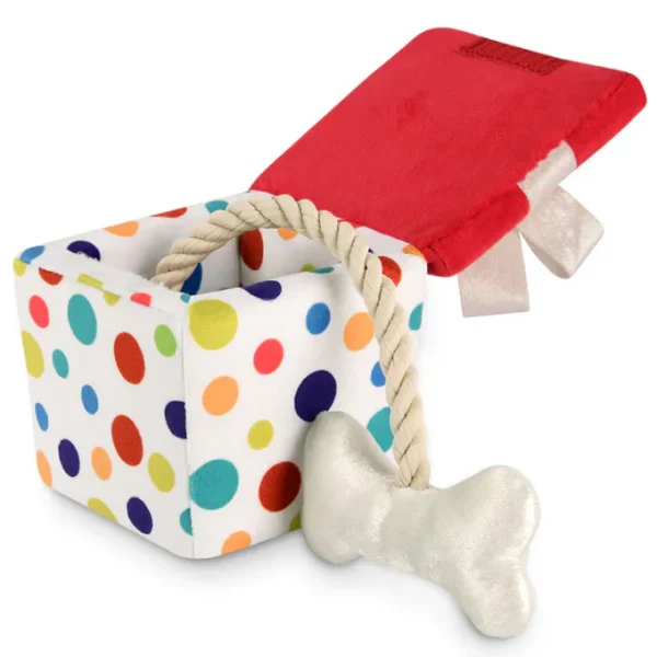 The P.L.A.Y. Pawfect Present Plush Dog Toy in White is a charming, gift-shaped plush toy designed to make playtime feel like a special occasion for your pup. This toy features a cute present design wrapped in soft, high-quality fabric, with vibrant accents that mimic a gift bow on top. It comes with a squeaker inside to keep your dog entertained and engaged during play. Perfect for dogs who enjoy interactive, squeaky fun, this plush toy adds a festive and adorable touch to any dog's toy collection, making it ideal for holidays, birthdays, or everyday surprises!