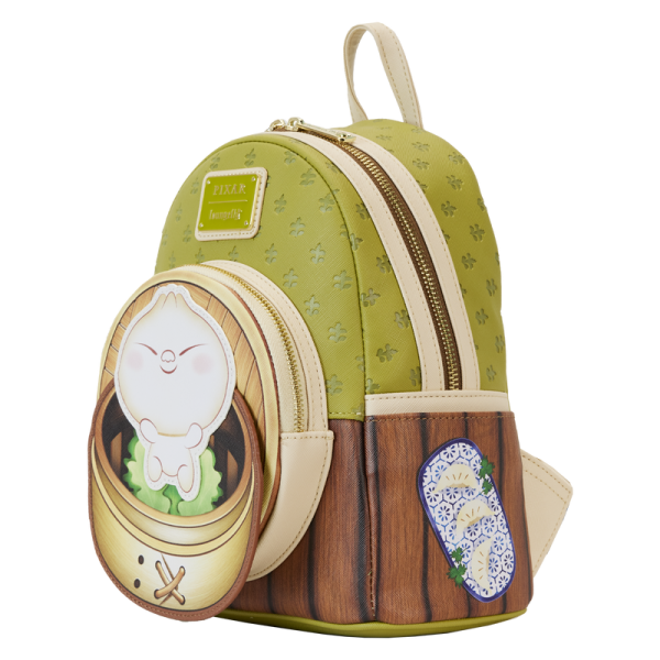 There’s nothing like a good meal to bring family together! Nurture your own little dumpling with the Loungefly Disney-Pixar Bao Bamboo Steamer Mini Backpack. On the front, a happy dumpling rests in a bamboo steamer basket on the zipper pocket while wallpaper details appear above. Turn the bag around to see soy sauce, chopsticks, and potstickers on the side pockets while a teapot appears on the bag’s back. This mini backpack has plenty of room to hold your belongings and will keep you company on all your adventures. The Loungefly Disney-Pixar Bao Bamboo Steamer Mini Backpack is made of vegan leather (polyurethane). Bag has adjustable shoulder straps and shiny gold hardware. Additional details include applique, debossed, and printed details. Take note of the coordinating inside lining. This backpack is an officially licensed Disney-Pixar product. Backpack dimensions: 9”W 10.5”H x 4.5”D