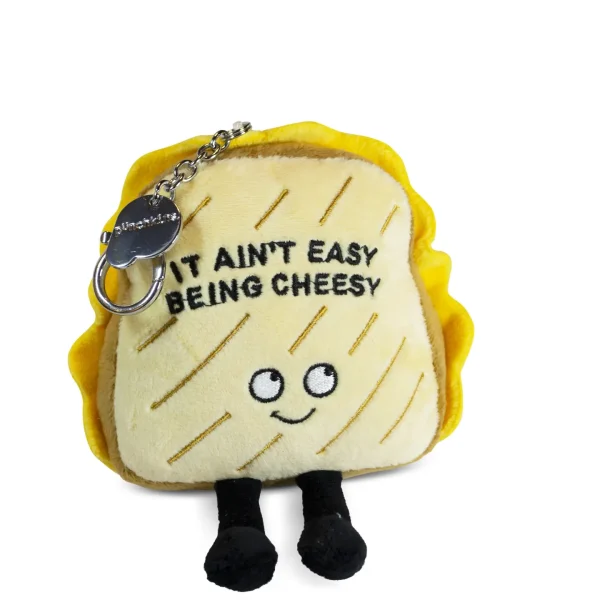 It ain't easy being cheesy? You feta believe it's not! Sometimes life's not all it's cracker-ed up to brie, but you can't let it get you down! This Bag Charm knows that when things aren't going grate, you just gotta bring those gouda vibes! His sweet smile, dangly legs, and 3D grill marks make this charm simply irresistible. He'd make a fun accessory for any bag or backpack. This plush is ideal for children, collectors, or anyone who loves cozy and fun decor.