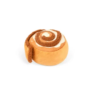 P.L.A.Y.'s Pup Cup Café Cinna-bone toy is a cinnamon roll delight that features a squeaker in the body for an extra dash of excitement with a crinkly bottom. In addition, the crinkles in the unraveling layer make playtime even more engaging, providing everlasting fun. Treat your pup to the irresistible charm, where every play session is a delectable adventure! Hand-made craftsmanship, double layer exterior and reinforced stitching for extra durability Eco-friendly PlanetFill® filler is made from 100% post-consumer certified-safe recycled plastic bottles Machine washable and dryer friendly Features AZO-free dyes