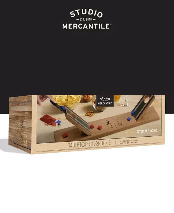 The classic cornhole game that we all know and love is now tabletop size! From Studio Mercantile comes the Wooden Tabletop Cornhole Game Set, 11 Pieces. This product is easy to assemble, so you can get playing as soon as possible! It is also portable, so this piece is truly the perfect thing to bring to any party or gathering. You are sure to liven up any and all events with this fun yet simple game. This corn hole game is great for players of all ages and skill levels, so it will surely keep everyone- even the kiddos- entertained all night! Not only is this game designed for fun, it is also designed with aesthetics in mind. The sleek and pretty wood that crafts this product will look as good as it is fun! Studio Mercantile's unique array of gifts carries the perfect products for a wide age-range of recipients. Shop the entire collection today and impress all your loved ones this season.