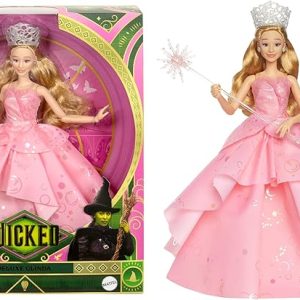 Inspired by Universal Pictures' Wicked, the deluxe Glinda doll captures her signature look from the musical film! Embellished bold, statement earrings, Glinda wears her voluminous, ruffled pink ballgown with iridescent foil bubble details that complete her magical look! The Good Witch doll accents her outfit with her wand and tiara! With true-to-movie looks and long blonde hair perfectly styled in curls, Glinda doll charms with a true-to-movie look! Clip Glinda doll onto the doll stand and create dramatic poses with 11 points of articulation! Highlighting the beauty of sisterhood and friendship, Wicked dolls make an inspiring gift for kids to play out their biggest dreams! Fans can collect their favorite Wicked characters to recreate scenes and make up their own storylines and adventures.