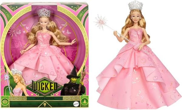 Inspired by Universal Pictures' Wicked, the deluxe Glinda doll captures her signature look from the musical film! Embellished bold, statement earrings, Glinda wears her voluminous, ruffled pink ballgown with iridescent foil bubble details that complete her magical look! The Good Witch doll accents her outfit with her wand and tiara! With true-to-movie looks and long blonde hair perfectly styled in curls, Glinda doll charms with a true-to-movie look! Clip Glinda doll onto the doll stand and create dramatic poses with 11 points of articulation! Highlighting the beauty of sisterhood and friendship, Wicked dolls make an inspiring gift for kids to play out their biggest dreams! Fans can collect their favorite Wicked characters to recreate scenes and make up their own storylines and adventures.