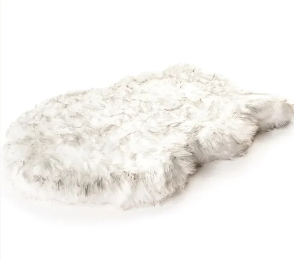 The Paw Brands PupRug Faux Fur Dog Bed in Beige (Small) is a luxurious and stylish pet bed designed to provide maximum comfort for your dog while blending seamlessly with home decor. This bed features a soft, faux fur cover that mimics the texture of real fur, creating a cozy and inviting surface for your pet to relax on. The memory foam base offers orthopedic support, helping to relieve pressure on joints, making it especially beneficial for smaller dogs or pets with arthritis or other mobility issues. The bed is both functional and fashionable, with a non-slip bottom to keep it in place. The PupRug is machine washable, ensuring easy cleaning and maintenance, while the chic beige color enhances the aesthetic of any room.