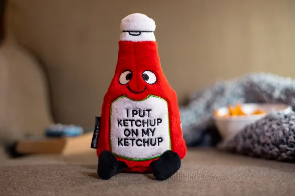 If this plushie had a slogan, it would be: i love ketchup from my head to-ma-toes! He needs ketchup on top of his ketchup with a side of ketchup. To him, no meal is complete without¦you guessed it¦ketchup. His silly smily, dangly legs, and bottle detail make him so easy to love. He's the perfect gift for any ketchup-loving kid! This plush is ideal for children, collectors, or anyone who loves cozy and fun decor.