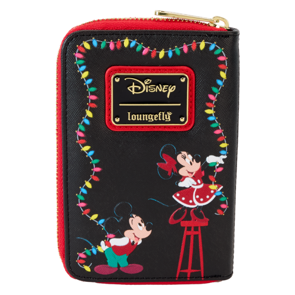 Hip-hip-hooray! Festive lights coming your way! Keep all the holiday lights close wherever you go with our Disney’s Mickey Mouse and Friends zip-around wallet. An elegant black background makes the festive lights outlining the border on the front pop. Disney’s Donald Duck is all wrapped up in a colorful strand of holiday lights that appears along the border. On the back, Disney’s Mickey Mouse and Minnie Mouse hang their own string of lights, and in the dark, the lights on both sides of the wallet glow. Spread the cheer and warmth of the season in style with this brilliant accessory. Features: Vegan leather (polyurethane) Approximately four slots for holding cards One clear ID holder with a die-cut shape of a light bulb Zipper for securing items Shiny gold-colored metal hardware Debossed, glow-in-the-dark, and printed details Coordinating inside lining Dimensions: 6”W x 4”H This wallet is an officially licensed Disney product.