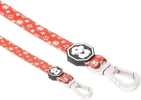 The Fresh Pawz "The Monogram Hype" Dog Leash in Multi (Large) is a trendy and stylish leash designed for both fashion-forward pets and their owners. Featuring a vibrant, eye-catching monogram pattern, this leash combines durability with flair. Made with high-quality materials, it ensures strength and longevity, suitable for large dogs that need a sturdy lead. The comfortable handle provides a secure grip, while the metal clasp easily attaches to any collar or harness. This leash is perfect for those who want to make a bold statement during walks, blending functionality with a modern, hype-inspired design.