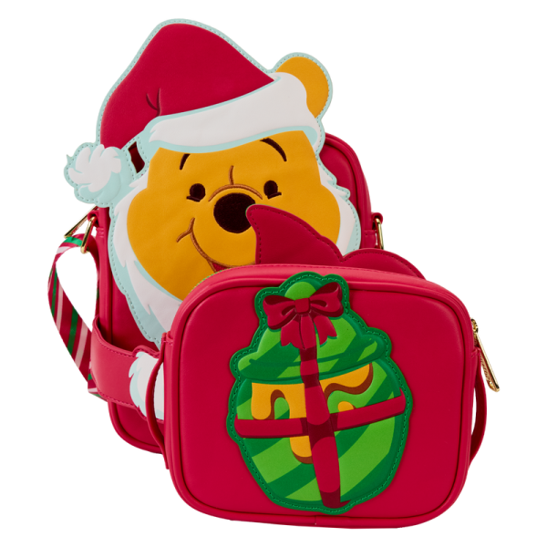 Hang the lights and pass the honey! Our Disney’s Winnie the Pooh Crossbuddies™ bag is a festively sweet way to celebrate the holidays in style. Winnie the Pooh is all decked out in a Santa hat and beard. His applique hands hug a detachable, reversible coin bag, which you can fill with a sweet treat or two. On one side, you’ll find an applique print of Disney’s Piglet, and on the other side, you’ll discover a printed applique of a beautifully wrapped honey pot gift. Piglet even makes an encore appearance as a print, inside a jar of honey. Make the season even sweeter with this fun accessory. Features: Vegan leather (polyurethane) Adjustable shoulder straps with a candy-cane striped print Detachable, reversible coin purse Gold-colored metal hardware Applique and printed details Coordinating inside lining Dimensions: 6.25”W x 8.25”H x 2.25”D