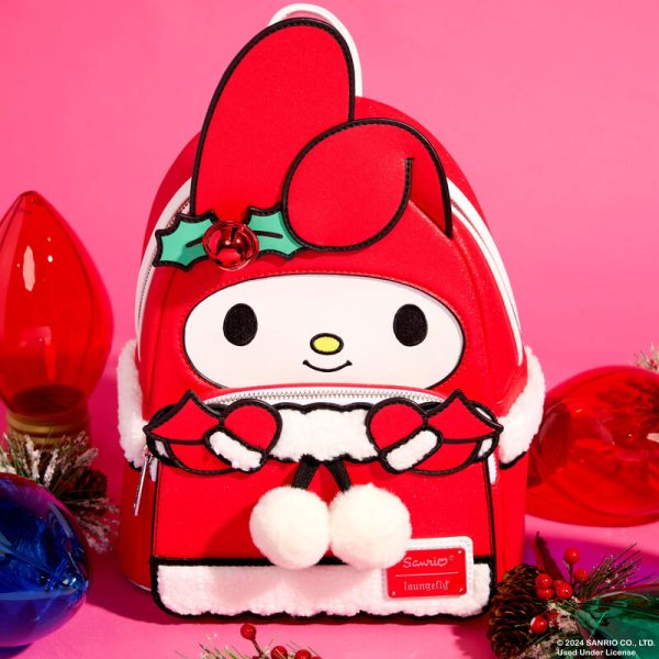 Ring in the holidays with the sweetest of sounds. Our My Melody mini backpack features a real jingle bell decoration—and other festive surprises. Her characteristic hat rises up in applique detail, over the front pocket, which is also decked out for the holidays. Fluffy white sherpa details accent the glittery red of her attire—and white pom-poms hang from real-cord details. There’s plenty of room to secure your daily essentials and share the gift of friendship wherever you go. Features: Vegan leather (polyurethane) Padded, adjustable shoulder straps Side panels with sherpa details Zippered main compartment Zippered front compartment Silver-colored metal hardware Jingle bell Applique, sherpa, glitter, embroidered, real cord, pom-pom, and printed details Coordinating inside lining Dimensions: 9”W x 10.5”H x 4.5”D This backpack is an officially licensed Sanrio product.