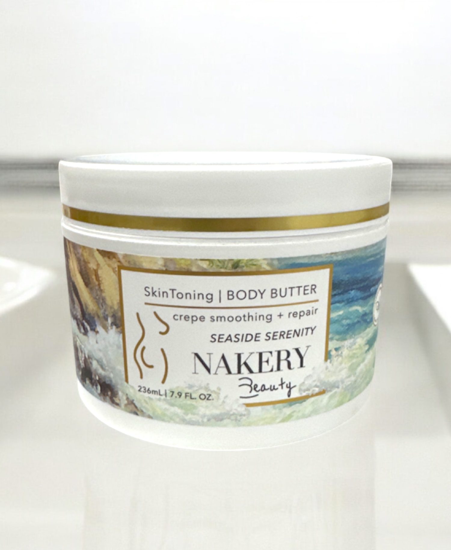 Nakery Body Butter in Seaside Serenity is a luxurious and deeply moisturizing body cream that pampers your skin while evoking the calming essence of a seaside escape. Infused with nourishing ingredients, this body butter provides intense hydration, leaving your skin feeling soft, smooth, and revitalized. The serene, ocean-inspired scent of Seaside Serenity adds a refreshing and soothing fragrance, making it perfect for a relaxing self-care routine. Its rich, creamy texture absorbs quickly into the skin, making it ideal for addressing dryness and maintaining a healthy, radiant glow all day long.