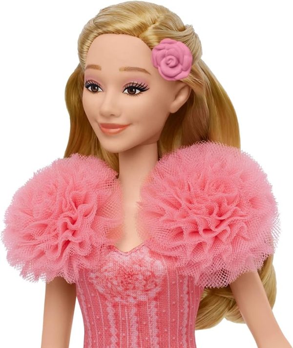 Inspired by Universal Pictures’ Wicked, the singing Glinda fashion doll brings the music to life! Sing “Popular” along with Glinda -- press the button to hear one 15-second clip, then press it again to hear a second 15-second clip. Glinda doll wears a soft, removable, pink ombre dress with puff sleeves and features her long blonde hair -- use her hair clip accessories to create even more Glinda-fied styles and looks! Highlighting the magic of sisterhood and friendship, Wicked dolls make an inspiring gift for kids to play out their biggest dreams! Fans can collect their favorite characters to recreate scenes and make up their own storylines and adventures