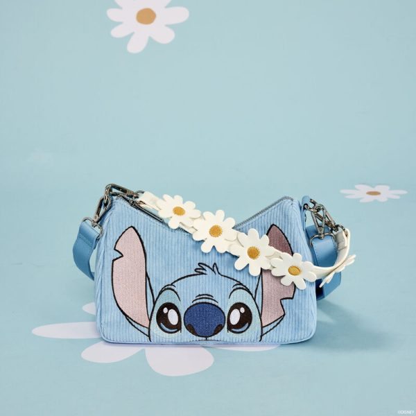 New beginnings are in bloom! Embrace a season of fresh starts with the Loungefly Lilo & Stitch Springtime Stitch Daisy Handle Crossbody Bag. Covered in corduroy material, this accessory shows Stitch peeking up from the bottom of the bag. Up above, vegan leather daisies cover a detachable handle. Turn the bag around to see a duckling watching a butterfly near the bag’s external zipper pocket. This crossbody bag has plenty of room to carry your belongings and makes an adorable companion to any outing with friends. The Loungefly Lilo & Stitch Springtime Stitch Daisy Handle Crossbody Bag is made of corduroy with vegan leather (polyurethane) trim. Bag has adjustable (detachable) shoulder strap, detachable handle, and shiny silver hardware. Additional features include applique, embroidered, and printed details. Take note of the coordinating inside lining. This bag is an officially licensed Disney product. Bag dimensions: 8.75”W x 6.25”H x 3.5”D