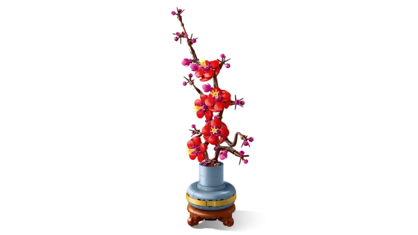 Take time out with the LEGO® Icons Plum Blossom (10369) flower decor building set for adults. The plum blossom is a popular motif in traditional art, often portrayed in ink-and-wash paintings as part of a classic quartet of beautiful plants known as the Four Gentlemen. Indulge in a mindful building project or treat a loved one to this timeless floral display – a perfect gift idea for any occasion. This detailed replica captures the elegance of the iconic winter flora with its woody stem and vivid red and magenta flowers. Set in a pastel-blue flowerpot with a golden band and wood-effect plinth, it is easy to assemble, delivers a rewarding building experience and makes a beautiful, easy-care flower display for the home and office. Discover a space for relaxation with buildable models from the LEGO Botanical Collection, part of the inspiring range of LEGO building sets designed for adults. A digital version of the building instructions is available in the LEGO Builder app. Flower decor building set for adults – Take time out or join friends and family for a relaxing building experience with the LEGO® Icons Plum Blossom flower building project Creative building for plant-lovers – This creative building set includes everything you need to craft a plum blossom flower and a pastel-blue pot with a golden band and wood-effect plinth Detailed LEGO® flower set for new and experienced builders – This LEGO interpretation of a plum blossom plant comes with an elegant woody stem and vivid red and magenta flowers Easy-care flower display for the home or office – Add a self-sufficient splash of color to any space with this buildable, zero-maintenance floral display A mindful home decor gift idea – The LEGO® Icons Plum Blossom building set makes a great birthday or any-day gift idea for adult fans of LEGO building sets and flora Includes digital building instructions – The LEGO® Builder app features a digital version of the building instructions included with this set Part of the LEGO® Botanical Collection – Discover a space for relaxation with the wide range of LEGO construction sets designed specifically for adults Dimensions –The plum blossom flower, including the plant pot and plinth in this 327-piece building set, measures over 13.5 in. (34 cm) high, 6.5 in. (17 cm) wide and 3.5 in. (9 cm) deep