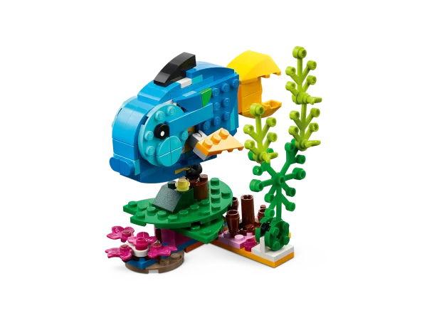 Little builders and passionate animal fans aged 7+ can travel deep into the rainforest for action-packed stories with this LEGO® Creator 3in1 Exotic Parrot (31136) building set. It features a colorful parrot that can fully rotate its body while sitting on a tree branch and move its wings and tail. 3in1 toys kick-start creative fun Kids have the chance to build 3 different exotic animal toys with this fantastic LEGO 3in1 set. They can build a colorful parrot sitting on a tree branch or rebuild it into a playful fish swimming at the bottom of the sea or a cheeky frog that can move its legs. A fun digital experience for LEGO fans Download the LEGO Builder app and step into a new world of building fun where kids can zoom in and rotate models in 3D, save sets and track their progress. 3in1 exotic animal toys – Kids aged 7+ can step into a rainforest with the LEGO® Creator 3in1 Exotic Parrot (31136) playset, featuring a parrot, a fish and a frog Endless play possibilities – Animal fans can stage different stories with a parrot perched on a tree, a fish swimming at the bottom of the sea and a playful frog Posable models – The parrot can rotate on its perch and move its wings and tail; the fish can lift its fins and be moved up and down; and the frog has posable legs A simple build – This 253-piece playset lets little builders aged 7+ enjoy a rewarding build-and-play experience and can be given as a reward or a birthday present Play on the go – Measuring over 8.5 in. (22 cm) high, 4 in. (11 cm) long and 4.5 in. (12 cm) wide, the parrot toy is a portable size for kids to take with them wherever they go More 3in1 fun – Look out for others in the LEGO® Creator 3in1 range, including the Space Shuttle (31134), Beach Camper Van (31138) and Cozy House (31139) sets A helping hand – Discover intuitive building instructions in the LEGO® Builder app, where kids can zoom in and rotate models in 3D, track progress and save sets as they develop new skills Premium quality – For more than 6 decades, LEGO® bricks have been made to ensure they pull apart consistently every time Safety assurance – LEGO® building bricks meet stringent global safety standards