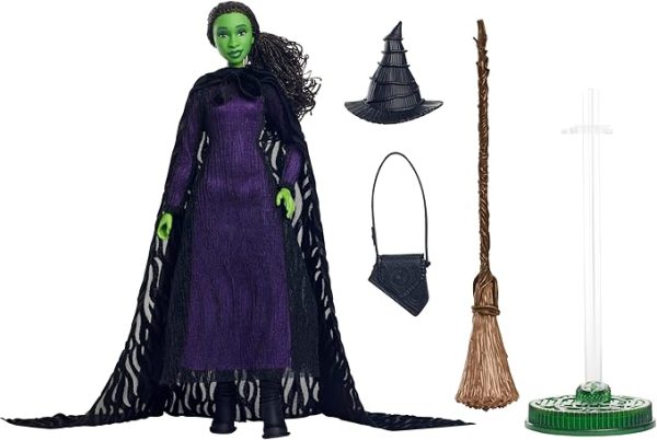 Inspired by Universal Pictures’ Wicked, this deluxe Elphaba doll captures her magical look from the musical film! With a cape draping over a sheer black dress and black boots, Elphaba can create a dramatic exit! Her iconic witch hat, broom, and satchel add the finishing touches to the signature look! With green skin and black braided hair, Elphaba doll charms with a true-to-movie look! Clip Elphaba doll onto the doll stand and create dramatic poses with 11 points of articulation! Highlighting the beauty of sisterhood and friendship, Wicked dolls make an inspiring gift for kids to play out their biggest dreams! Fans can collect their favorite characters to recreate scenes and make up their own storylines and adventures.