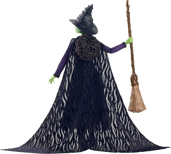 Inspired by Universal Pictures’ Wicked, this deluxe Elphaba doll captures her magical look from the musical film! With a cape draping over a sheer black dress and black boots, Elphaba can create a dramatic exit! Her iconic witch hat, broom, and satchel add the finishing touches to the signature look! With green skin and black braided hair, Elphaba doll charms with a true-to-movie look! Clip Elphaba doll onto the doll stand and create dramatic poses with 11 points of articulation! Highlighting the beauty of sisterhood and friendship, Wicked dolls make an inspiring gift for kids to play out their biggest dreams! Fans can collect their favorite characters to recreate scenes and make up their own storylines and adventures.